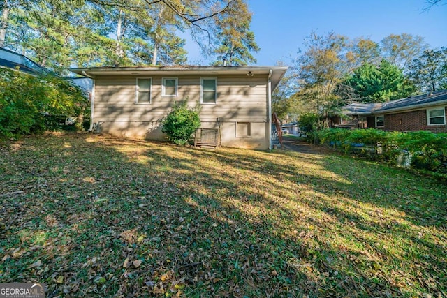 view of outbuilding with a yard