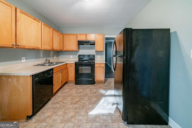 kitchen with light brown cabinets, sink, and black appliances