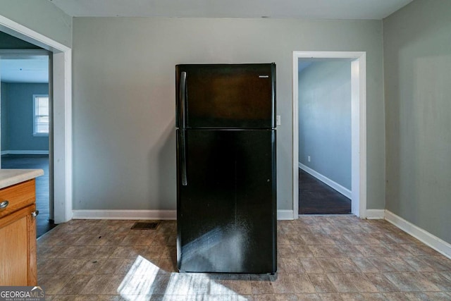 kitchen with black fridge