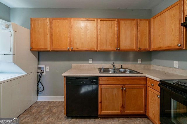 kitchen featuring sink, stacked washing maching and dryer, and black appliances