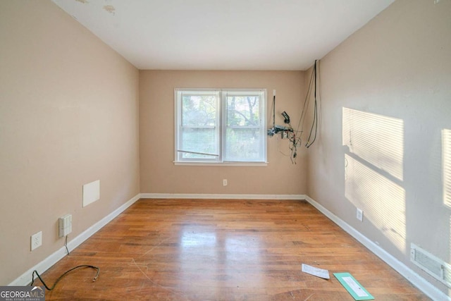 empty room with light wood-type flooring