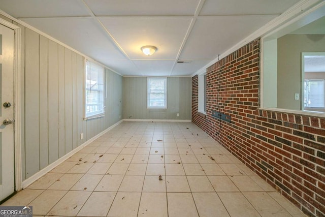 interior space featuring brick wall