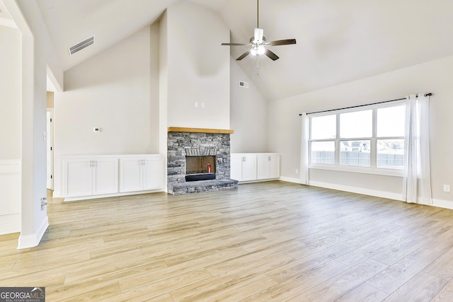 unfurnished dining area featuring an inviting chandelier, coffered ceiling, crown molding, light wood-type flooring, and beamed ceiling