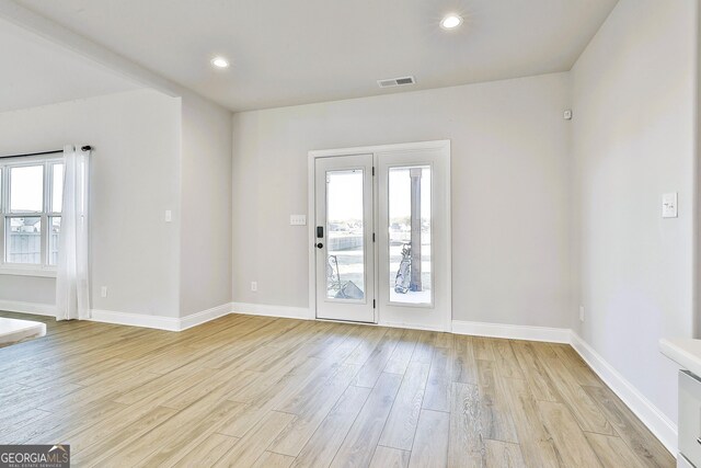 kitchen with appliances with stainless steel finishes, ceiling fan, sink, pendant lighting, and a center island with sink