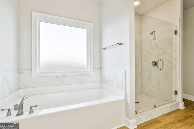 bathroom featuring hardwood / wood-style floors, vanity, and an enclosed shower