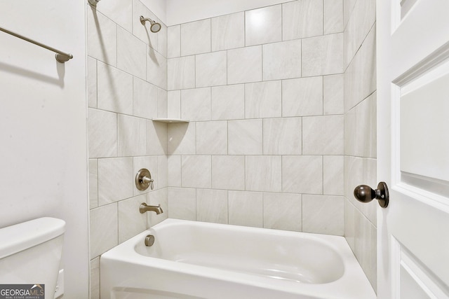 bathroom featuring vanity, wood-type flooring, and tiled shower / bath combo