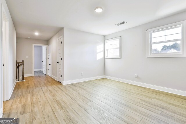 unfurnished room with light hardwood / wood-style floors