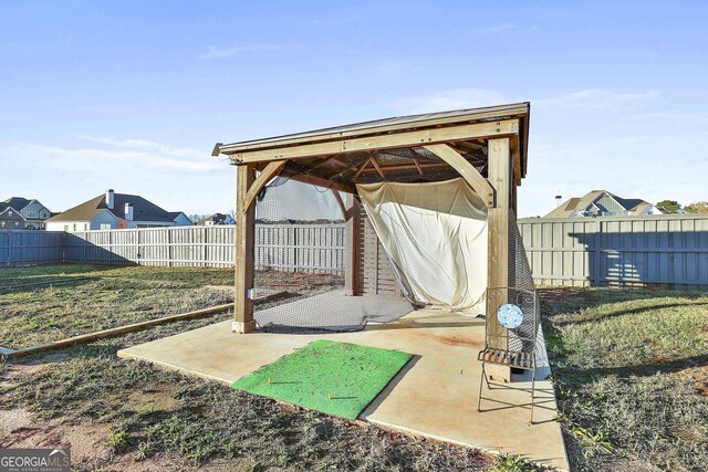 view of yard featuring a storage shed and a trampoline