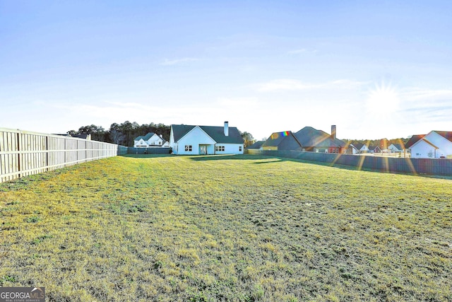 back of house featuring a lawn