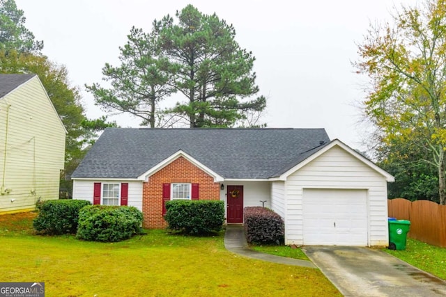 single story home with a front lawn and a garage