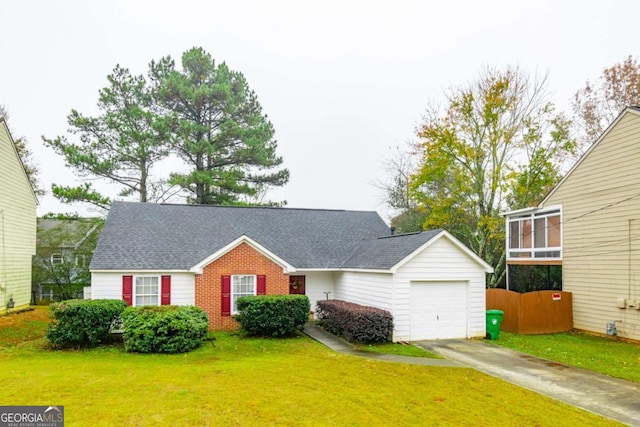 view of front facade featuring a garage and a front lawn