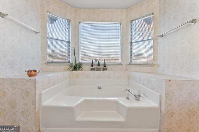 bathroom with a tub to relax in