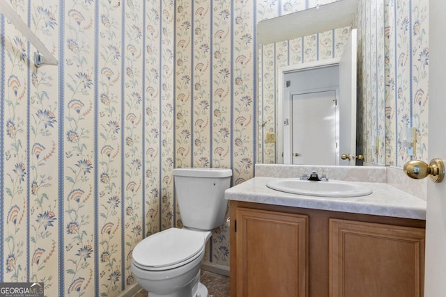 bathroom with vanity and toilet