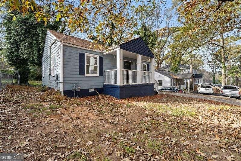 view of property exterior featuring a porch