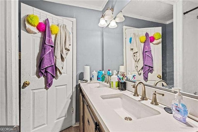 bathroom featuring vanity and ornamental molding