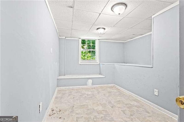 spare room with a paneled ceiling