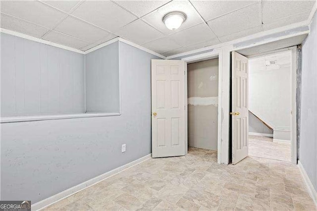 unfurnished bedroom with a drop ceiling