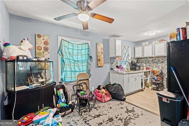 interior space with light hardwood / wood-style flooring and ceiling fan