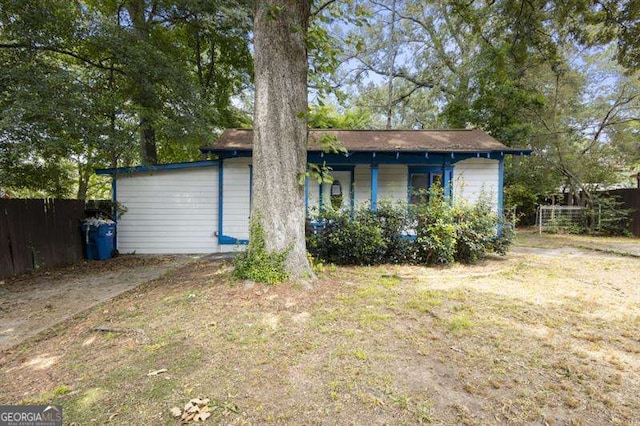 rear view of property with a lawn