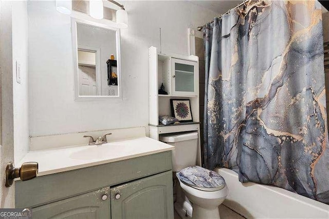 full bathroom with shower / bath combination with curtain, vanity, and toilet