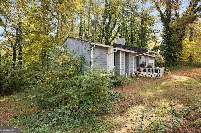 view of yard featuring a wooden deck