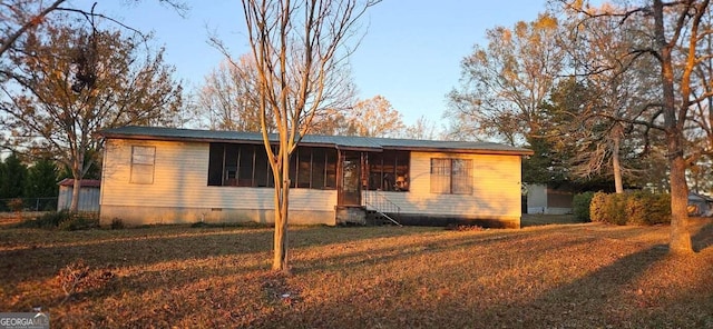 ranch-style home with a front yard