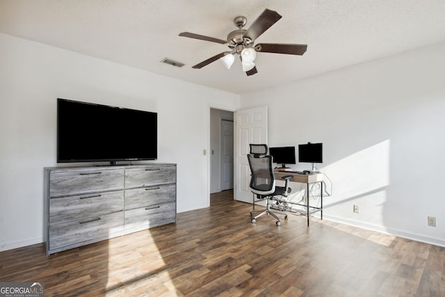 office area featuring dark hardwood / wood-style floors, ceiling fan, and a textured ceiling