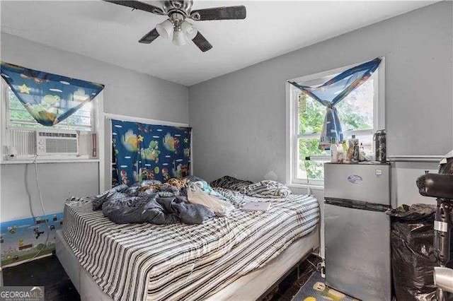 bedroom with ceiling fan and cooling unit