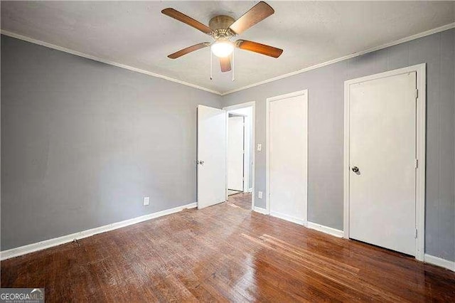 unfurnished bedroom with wood-type flooring, ceiling fan, and crown molding