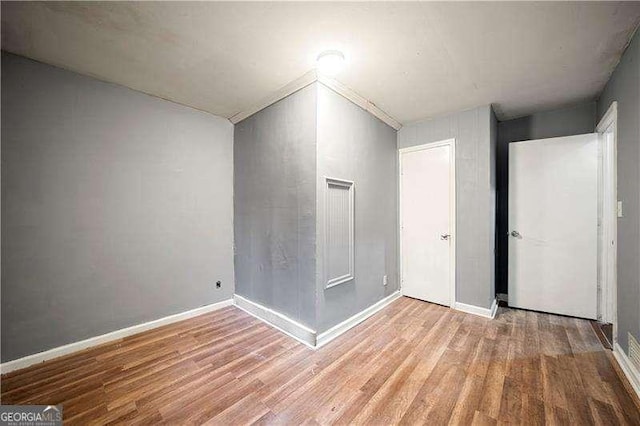 spare room featuring light wood-type flooring