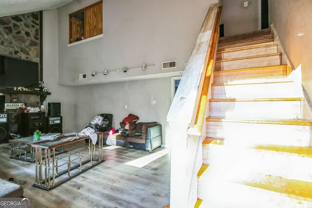 stairs with wood-type flooring