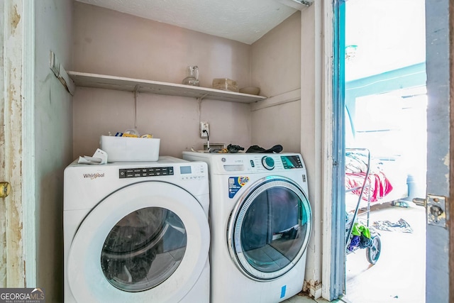 laundry room featuring washer and clothes dryer