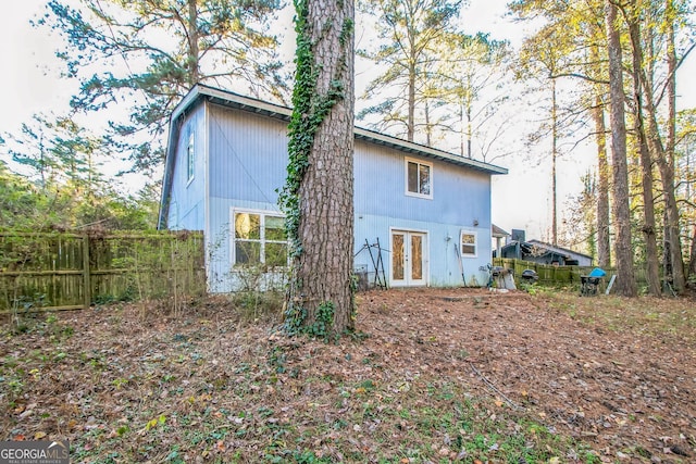 rear view of property featuring french doors