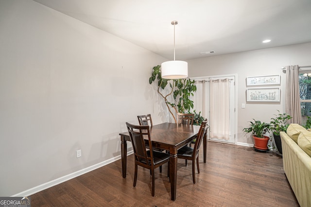 dining space featuring dark hardwood / wood-style flooring