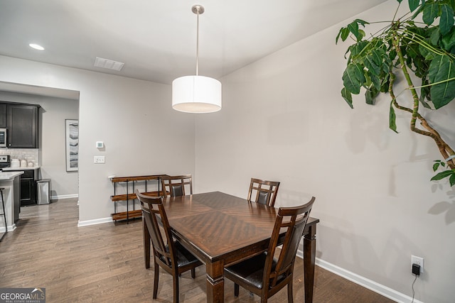 dining area featuring dark hardwood / wood-style flooring