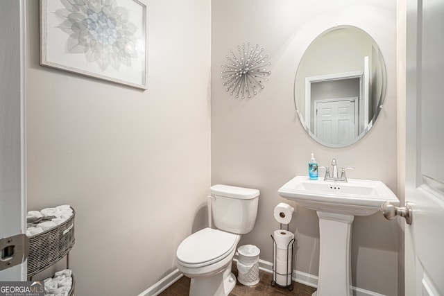 bathroom with toilet and sink