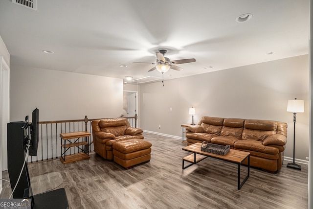 living room with ceiling fan and wood-type flooring