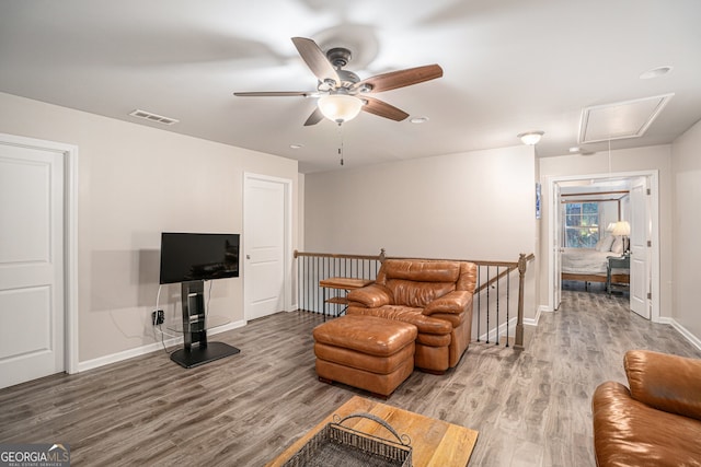 living room with ceiling fan and wood-type flooring