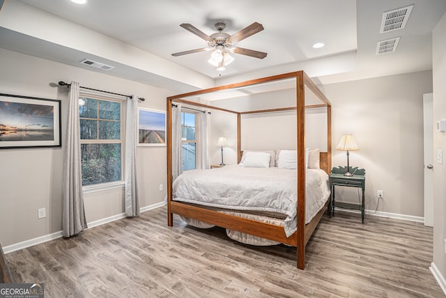 bedroom featuring hardwood / wood-style flooring and ceiling fan