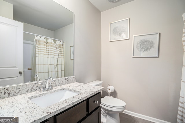 bathroom with hardwood / wood-style floors, vanity, toilet, and a shower with curtain