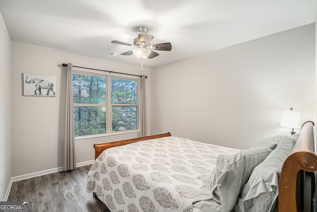 bedroom featuring hardwood / wood-style flooring and ceiling fan