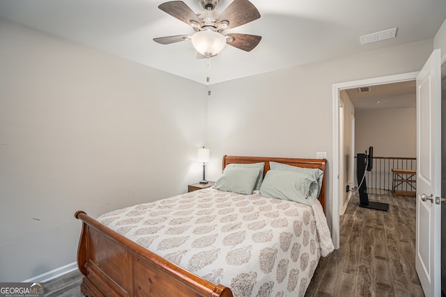 bedroom featuring ceiling fan and dark hardwood / wood-style flooring