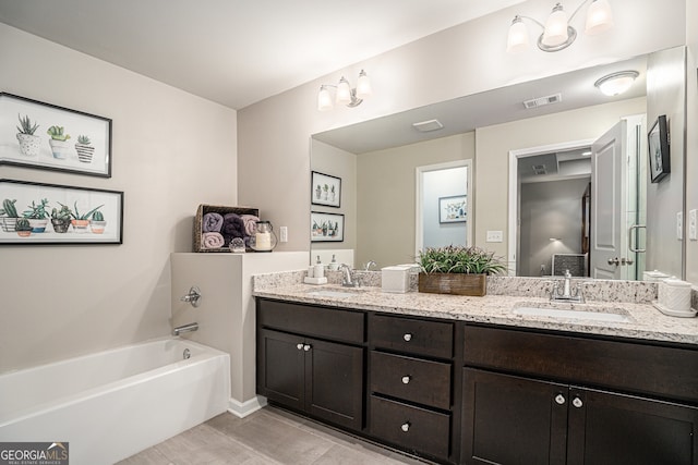 bathroom featuring shower with separate bathtub, vanity, and tile patterned floors