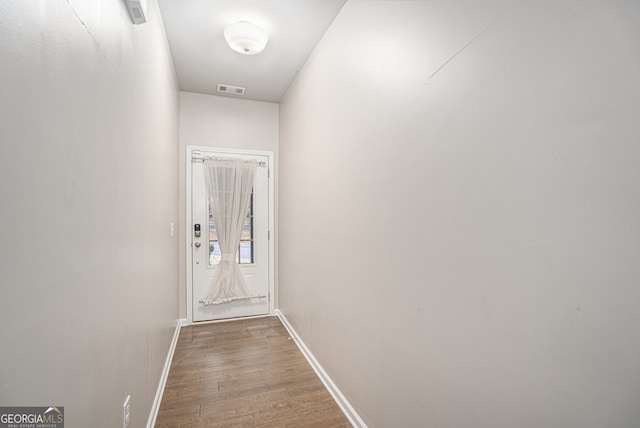 hallway with dark wood-type flooring