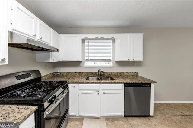 kitchen with white cabinetry, sink, stainless steel appliances, a textured ceiling, and light tile patterned flooring