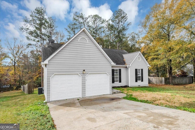 view of front of home with central AC unit, a garage, and a front lawn