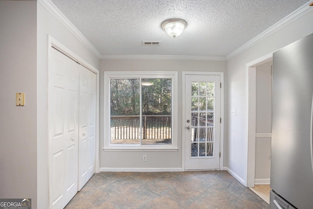 interior space featuring crown molding and a textured ceiling