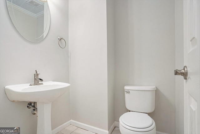 bathroom featuring tile patterned floors and toilet