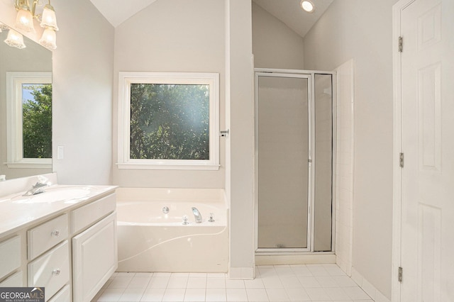 bathroom featuring shower with separate bathtub, vanity, and lofted ceiling