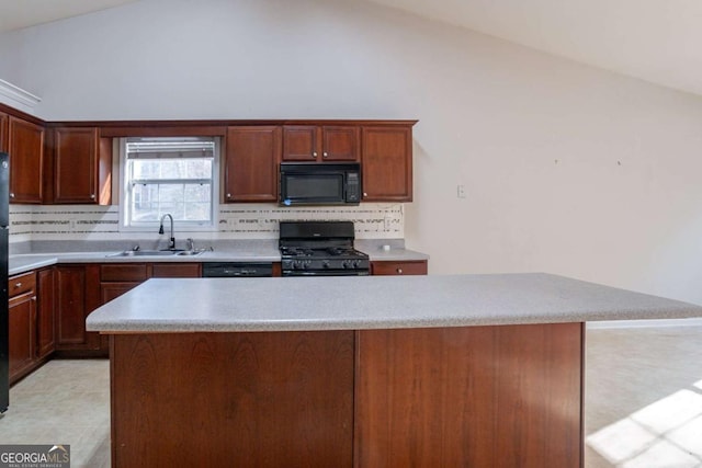 kitchen with black appliances, backsplash, lofted ceiling, and sink